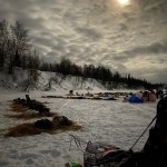a group of people in a boat on a body of water