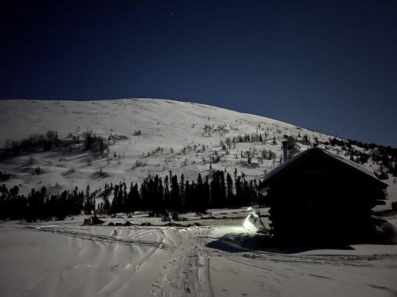a man standing on top of a snow covered mountain