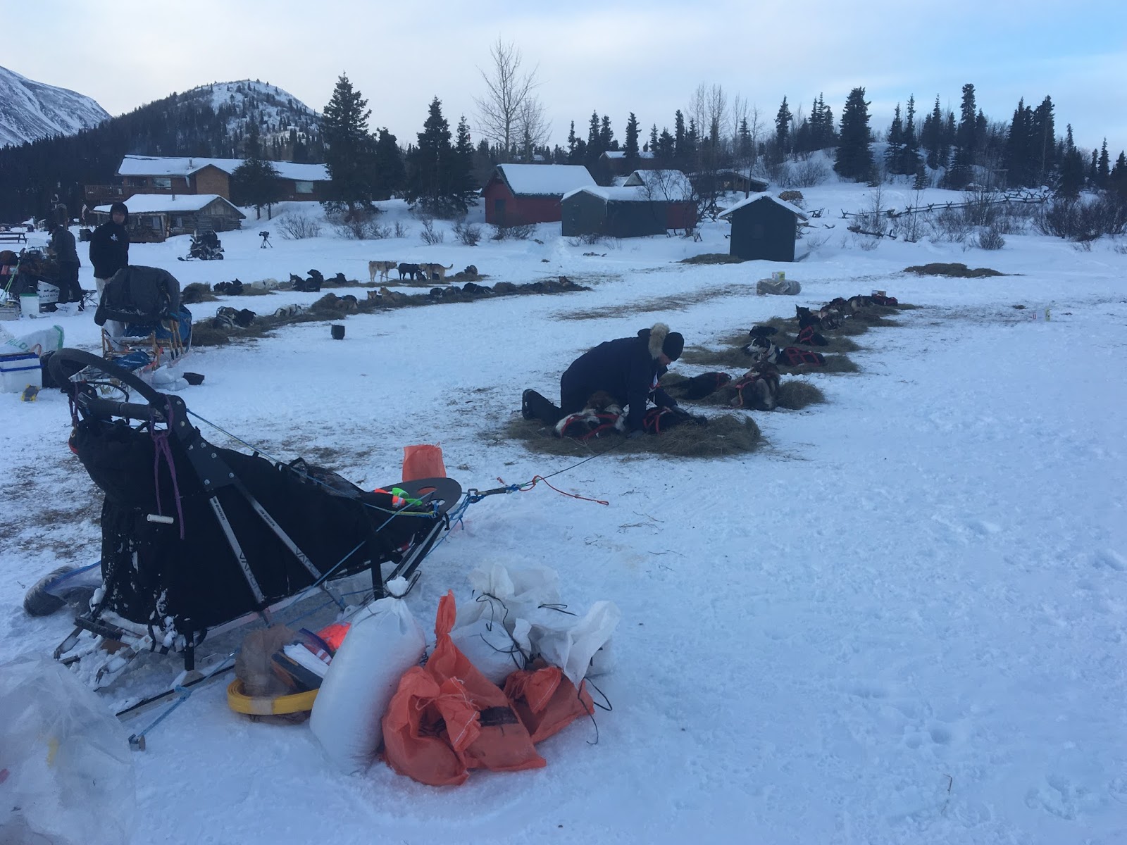 a group of people sitting in the snow