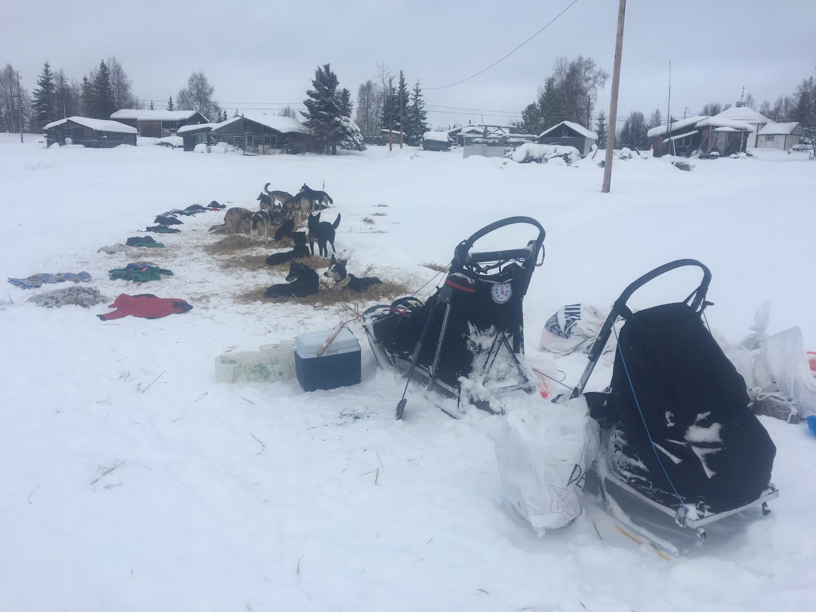 a group of people sitting in the snow