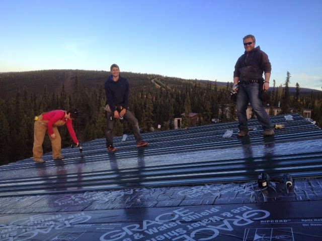 a group of people standing on a beach