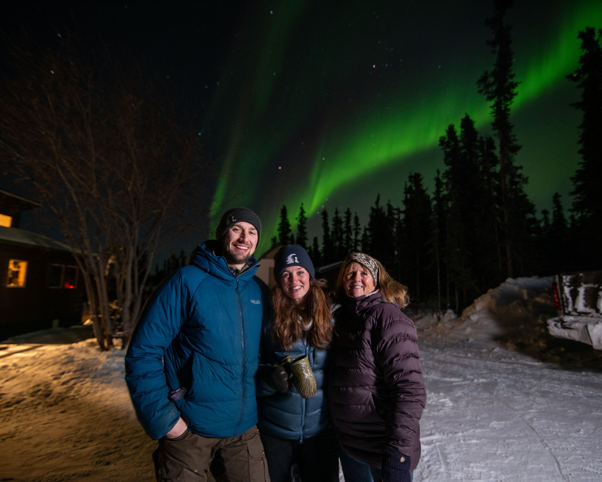 a man and a woman standing in the snow