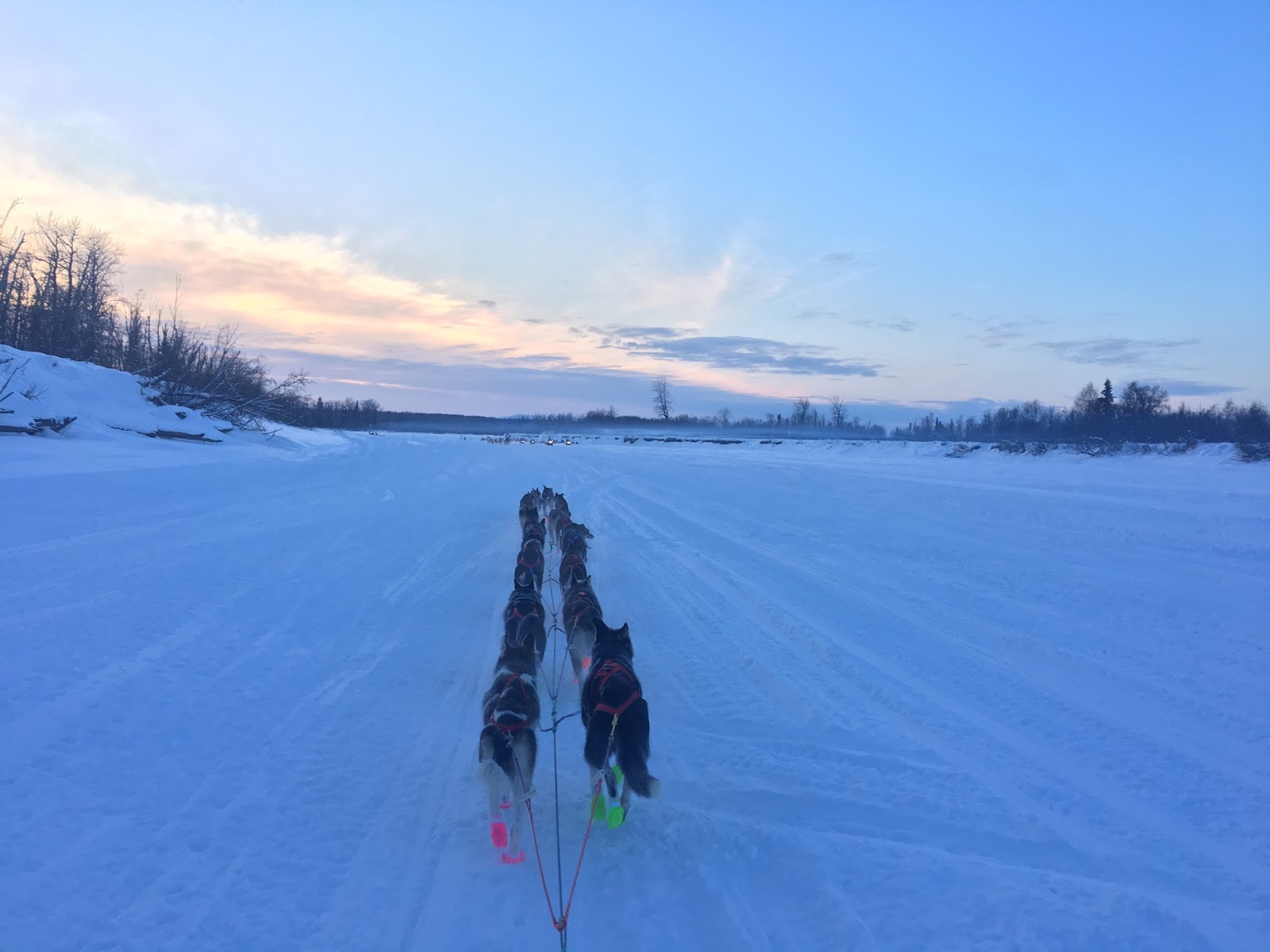 a man is cross country skiing on a snow covered slope